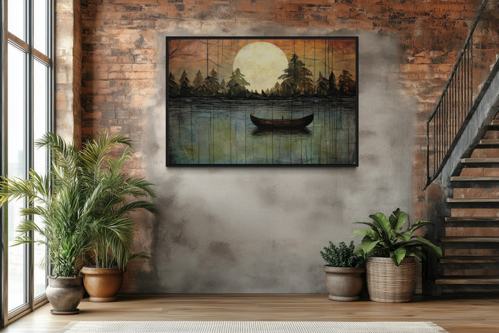 Framed canvas wall art of a boat on a moonlit lake in a rustic brick and concrete room.