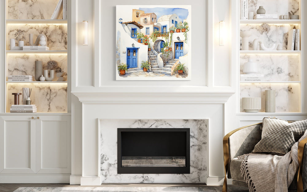 Greek Houses Santorini Greece watercolor framed canvas wall art hanging above a white fireplace.