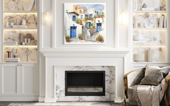 Greek Houses Santorini Greece watercolor framed canvas wall art hanging above a white fireplace.