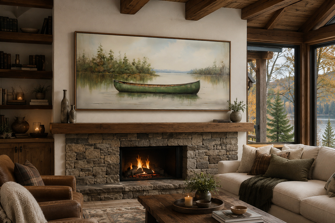Framed green canoe painting on wood canvas above a stone fireplace in a rustic cabin living room.