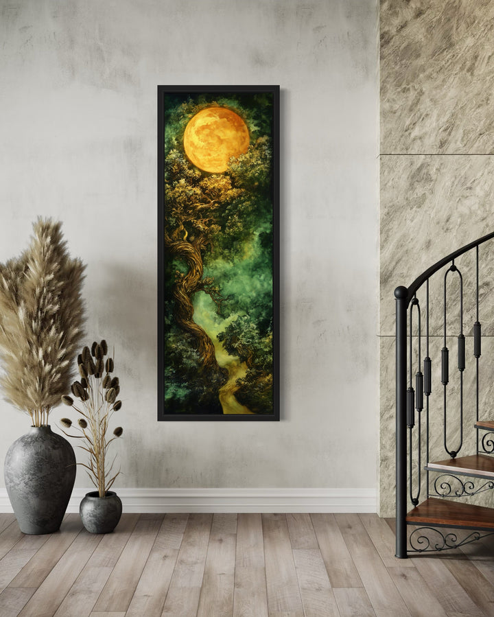 Tall narrow framed canvas art of a green Celtic tree of life under a glowing golden moon.