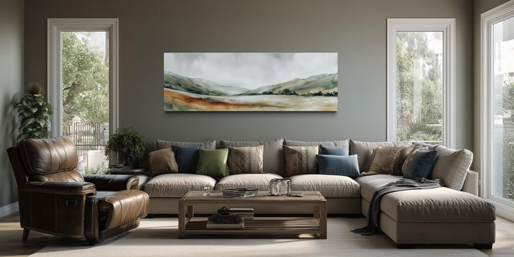 Panoramic green landscape canvas print featuring sage hills and misty sky in a minimalist living room.