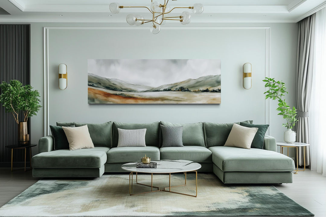 Panoramic green landscape canvas print featuring misty sage hills above a modern sectional sofa.