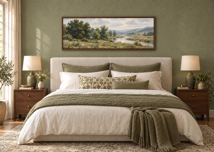 Green Valley and River Landscape long horizontal canvas wall art hanging above a bed.