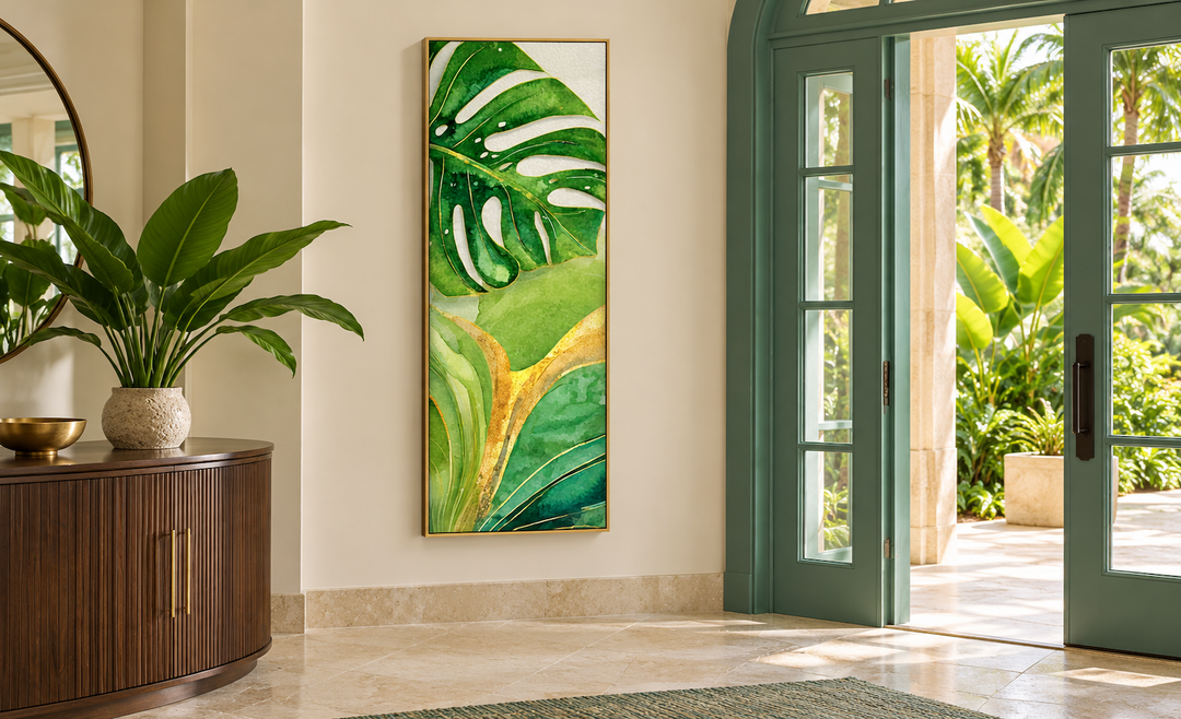 Tall narrow vertical canvas wall art featuring green and yellow tropical leaves in a gold frame.