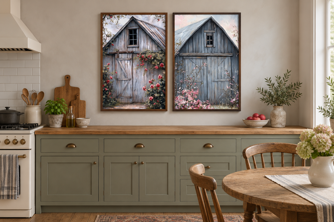 Two framed canvas paintings of rustic grey barn doors with floral accents in a farmhouse kitchen.