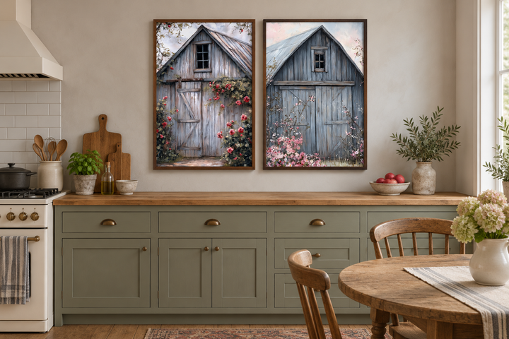 Two framed canvas paintings of rustic grey barn doors with floral accents in a farmhouse kitchen.