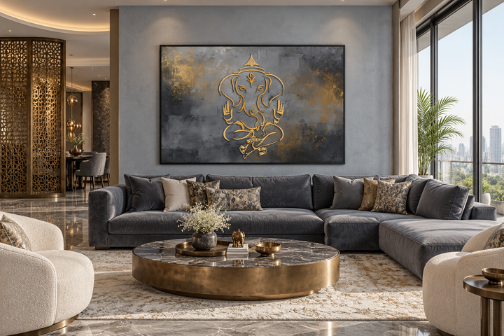 Minimalist grey and gold Lord Ganesh abstract painting in a black frame above a grey sofa.