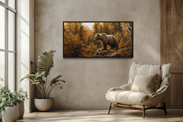 Grizzly bear in autumn forest canvas wall art in a rustic living room setting.
