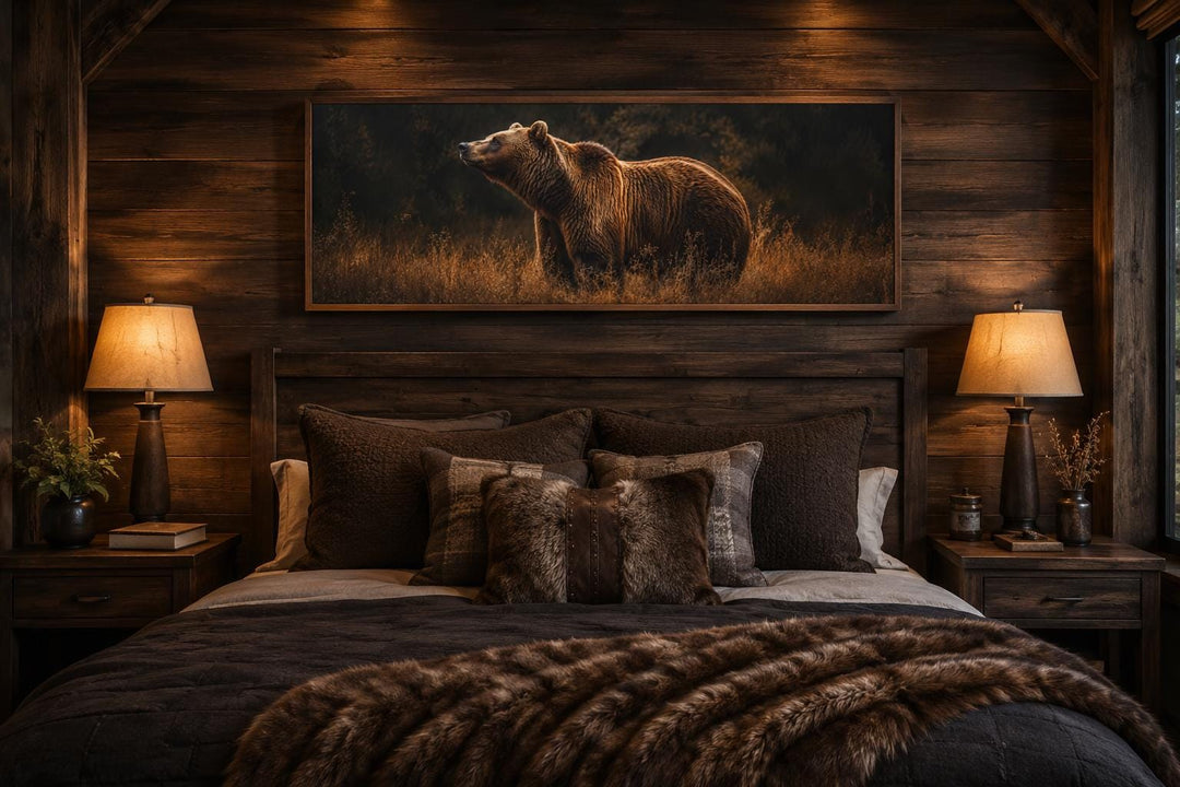 Grizzly bear canvas print in a rustic cabin bedroom above a wooden headboard with warm lighting.
