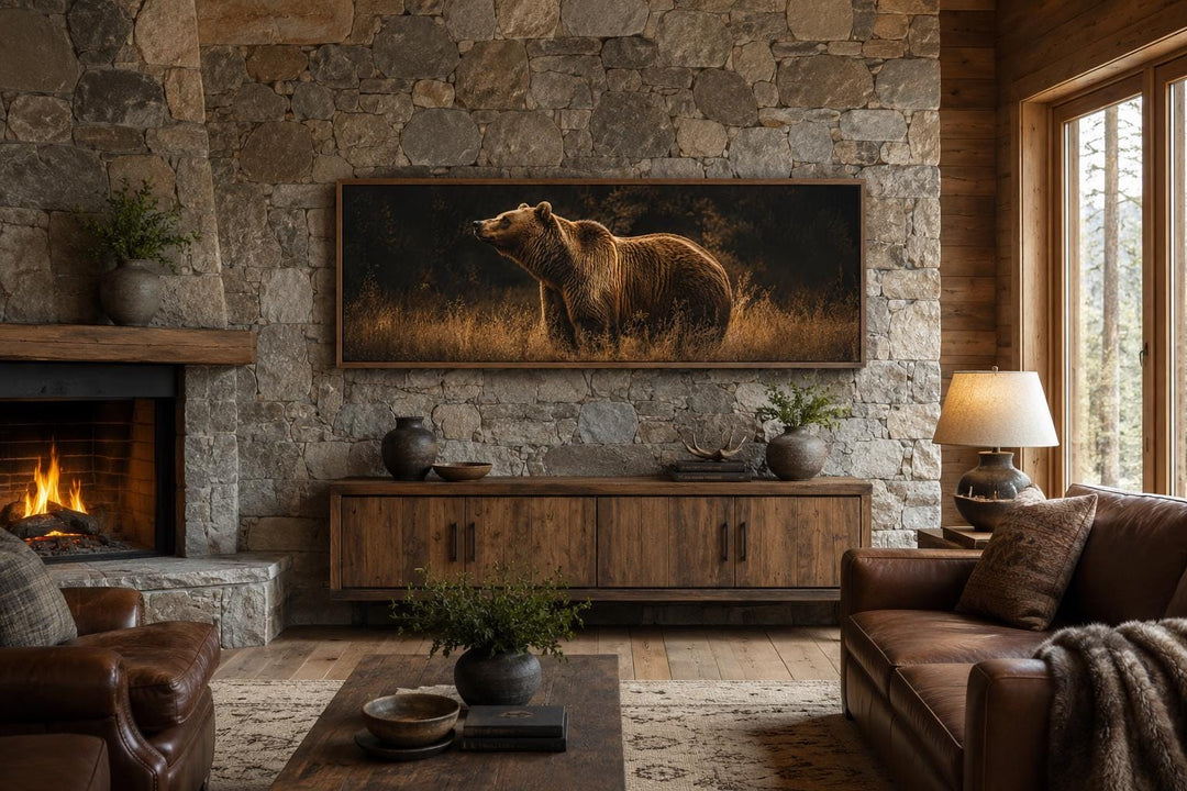 Grizzly bear standing in golden grass horizontal canvas art above a wooden console and stone wall.
