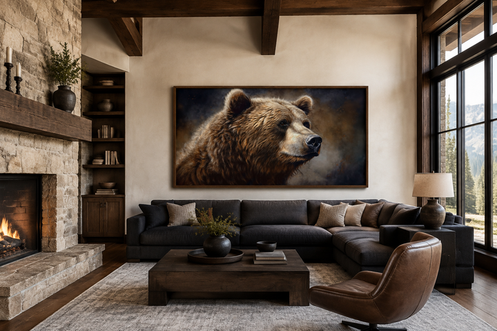 Extra large framed grizzly bear canvas wall art in a rustic living room above a dark sectional sofa.