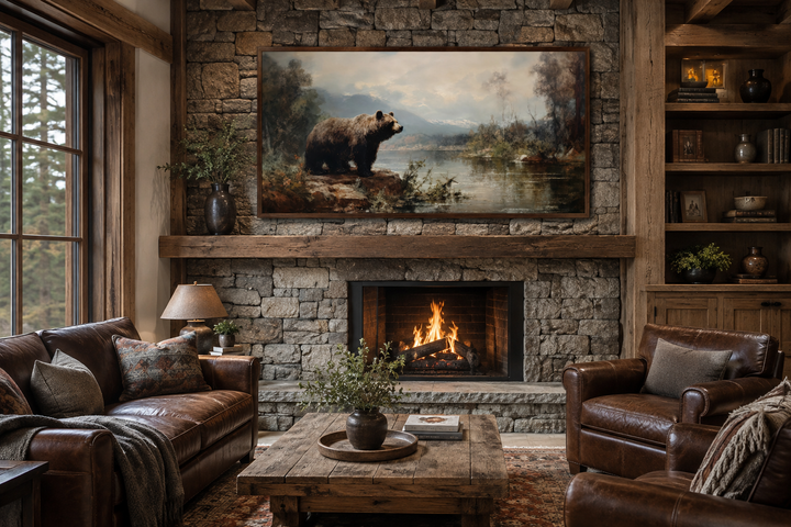 Framed grizzly bear canvas print above a stone fireplace in a rustic cabin living room.
