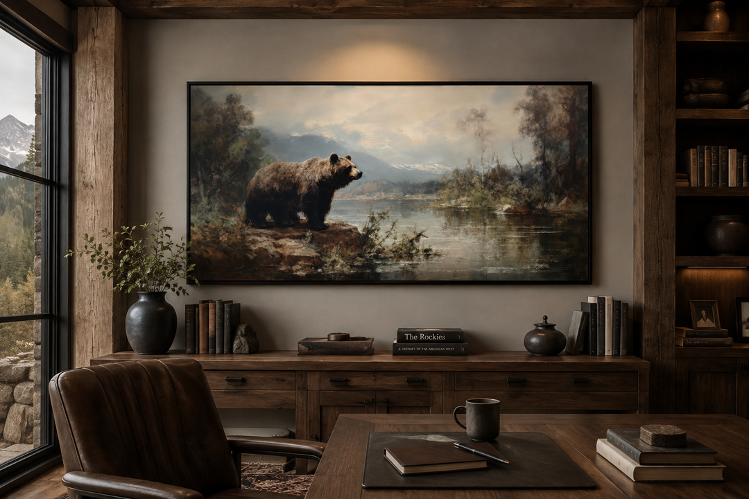 Framed grizzly bear canvas print on a wall in a rustic cabin office with wooden furniture.