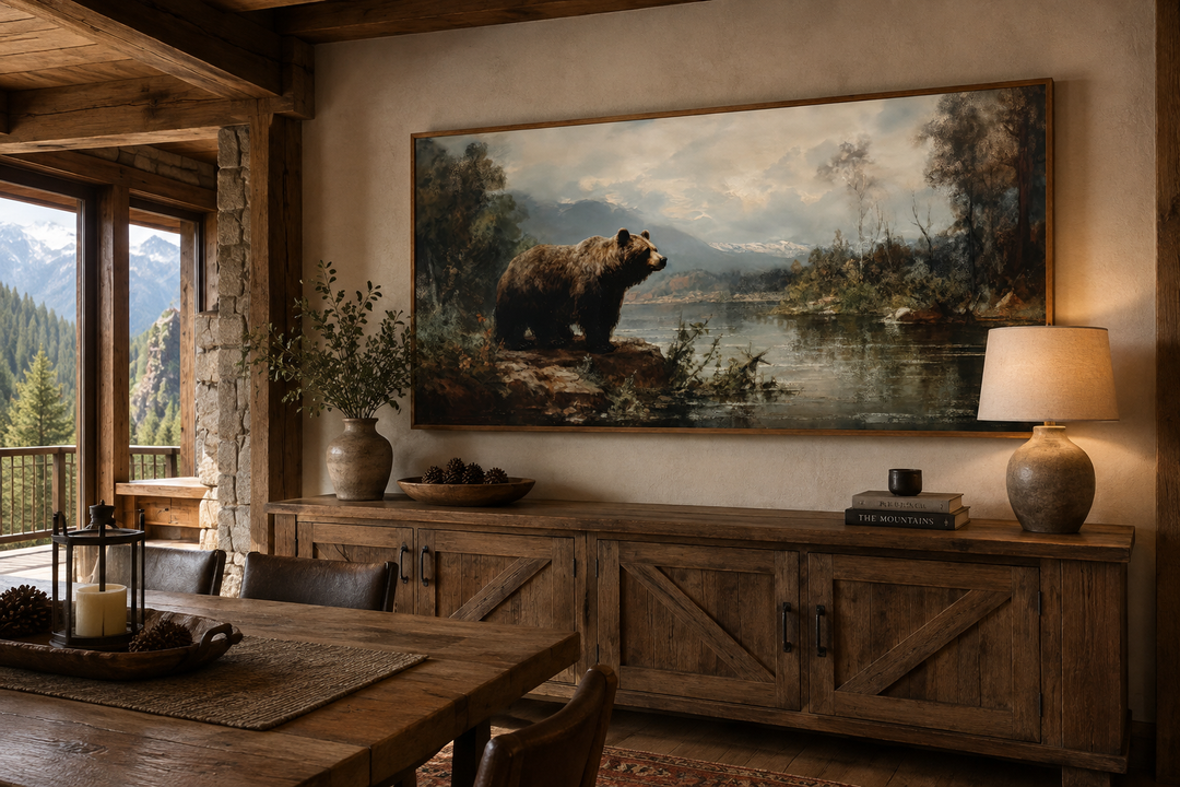 Framed grizzly bear canvas print on a wall above a rustic wooden sideboard in a cabin setting.