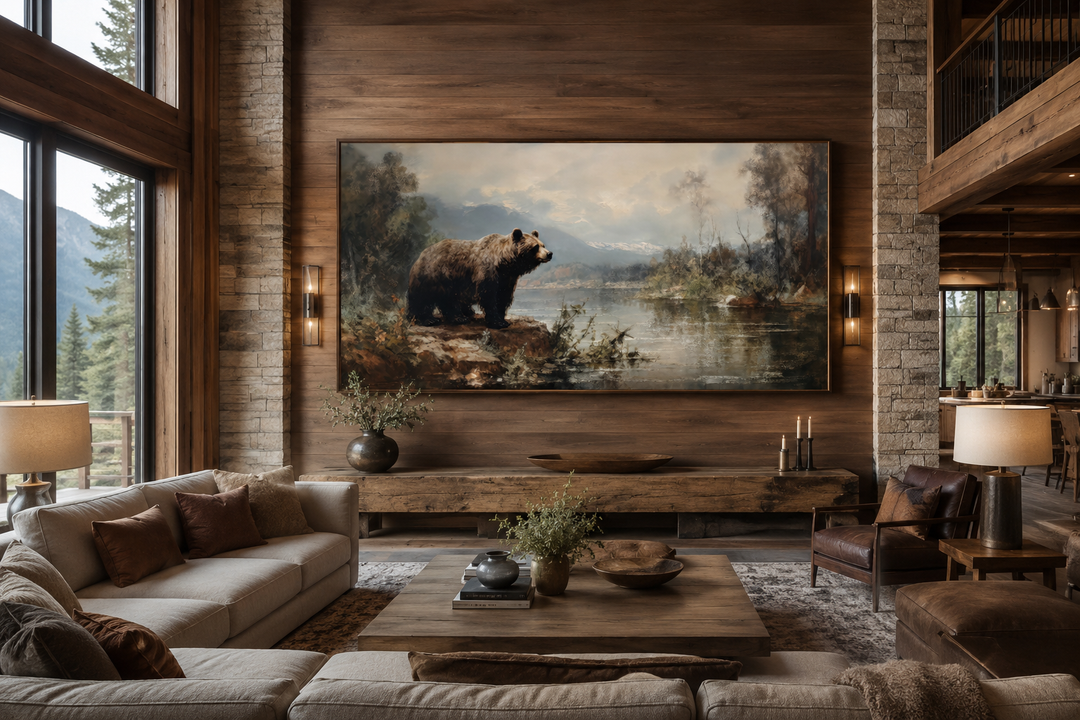 Framed grizzly bear canvas print on a wood-paneled wall in a rustic cabin living room.