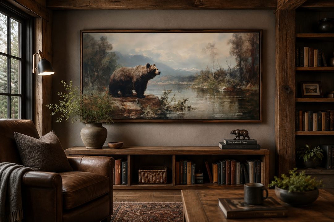 Framed grizzly bear canvas print above a wooden console in a rustic cabin living room.