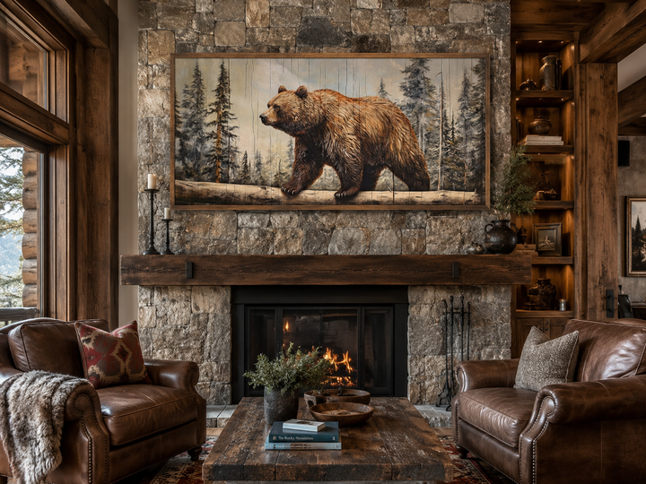 Grizzly bear wall art on wood effect canvas hanging above a stone fireplace in a rustic cabin.