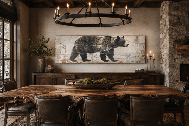 Long horizontal framed canvas wall art of a bear painted on wood, hanging in a rustic dining room.