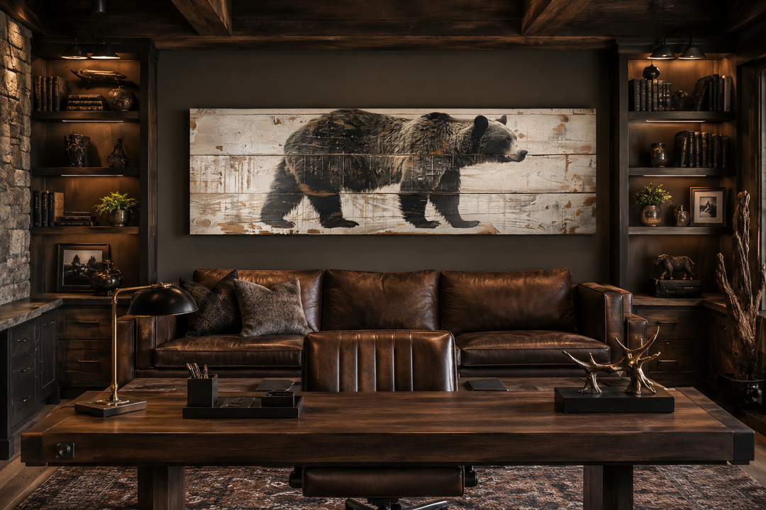 Long horizontal framed canvas wall art of a bear painted on wood in a rustic cabin office.