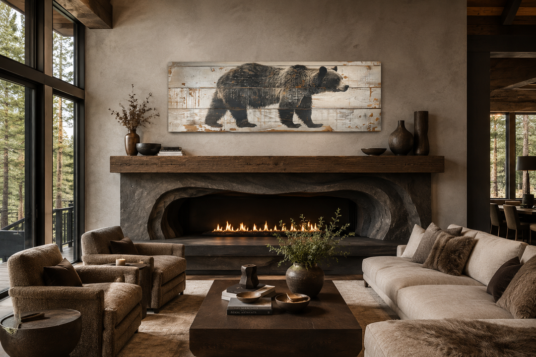 Long horizontal framed canvas wall art of a bear painted on wood above a rustic stone fireplace.