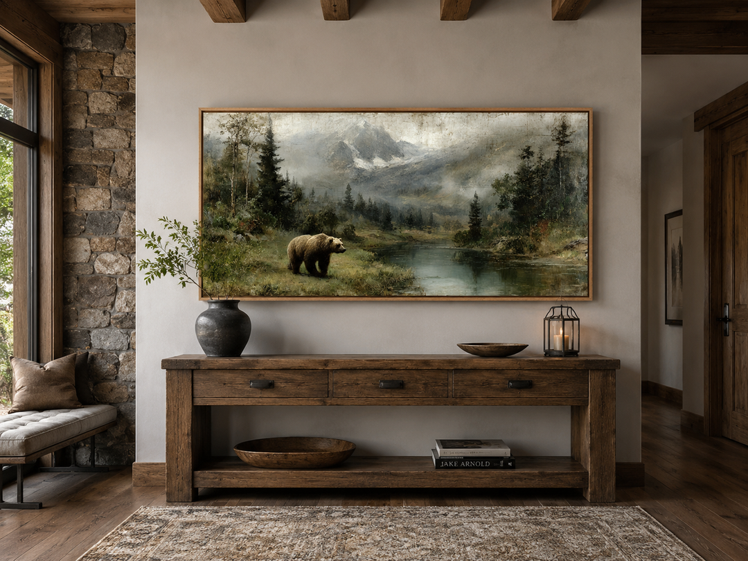Grizzly bear on the lake rustic framed canvas wall art above a wooden console table in a cabin.
