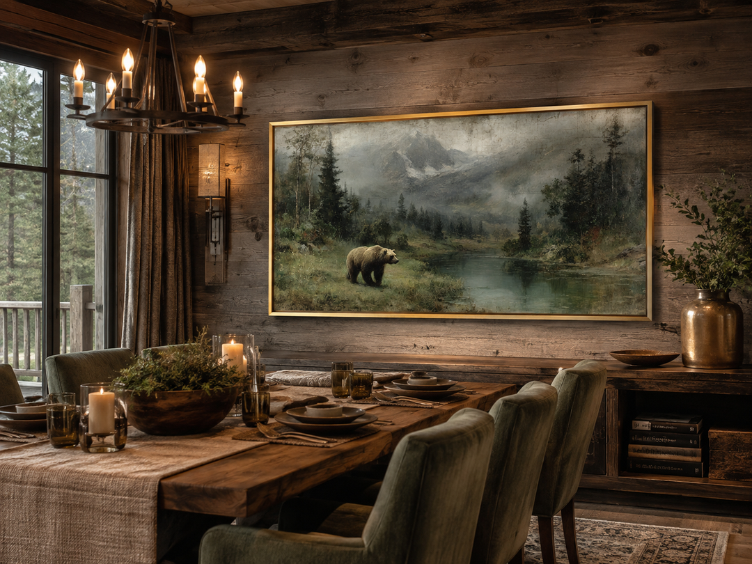 Rustic framed canvas wall art of a grizzly bear by a mountain lake in a cozy cabin dining room.