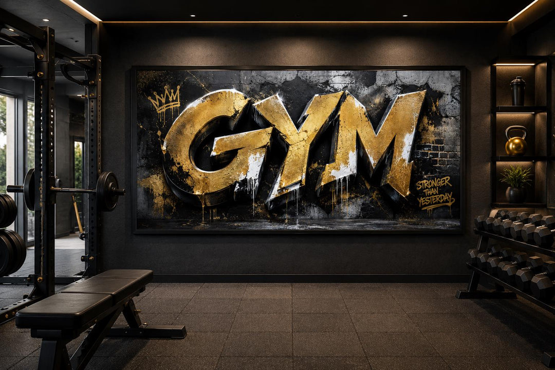 Gold graffiti Gym wall art with Stronger Than Yesterday text on a dark textured background.