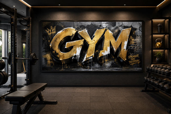 Gold graffiti Gym wall art with Stronger Than Yesterday text on a dark textured background.
