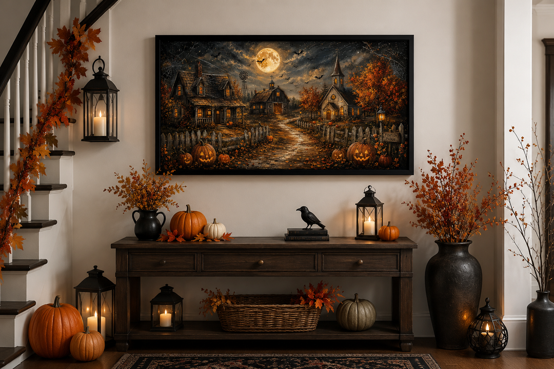 Framed Halloween farm wall art featuring pumpkins, bats, and a full moon above a console table.