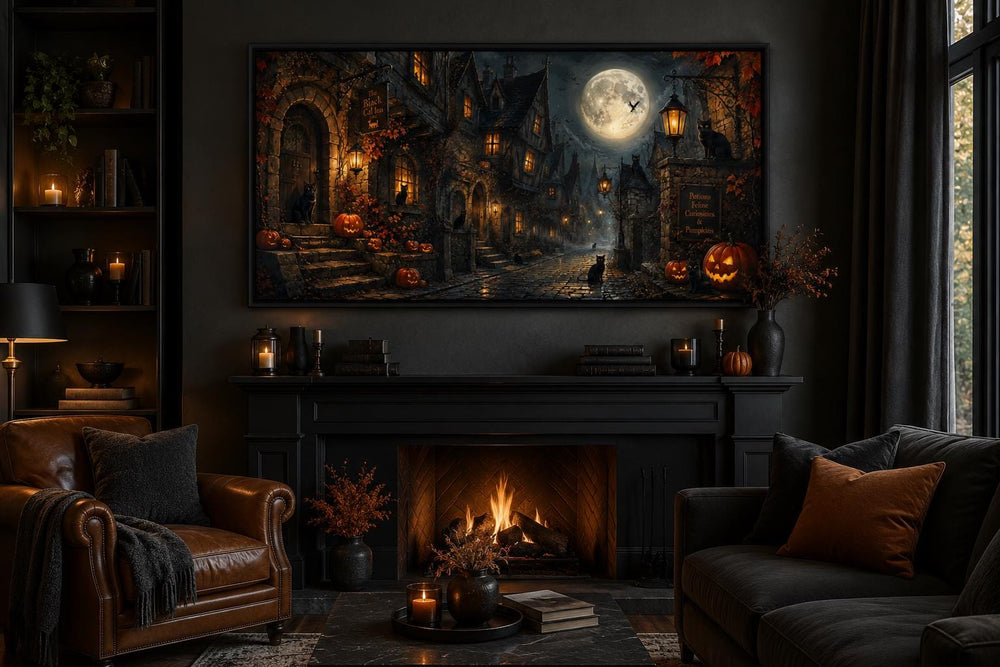 Halloween Village canvas art with black cats and pumpkins above a fireplace in a dark gothic room.