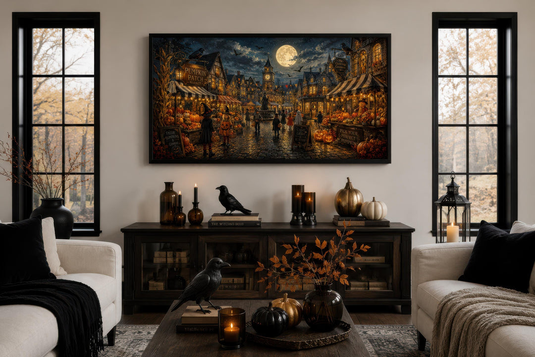 Halloween Village Wall Art canvas print above a console table with pumpkins and crow decor.