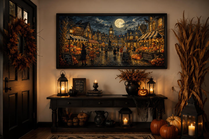 Halloween Village canvas print of trick-or-treating kids in a moonlit town above a console table.