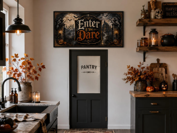 Enter If You Dare Halloween wall art canvas hanging above a black pantry door in a spooky kitchen.