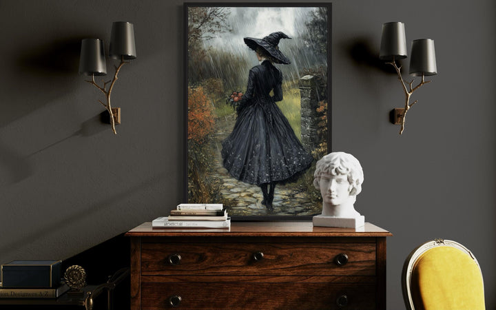 Halloween Witch in Black Hat Walking in Rain with Flowers Bouquet Wall Art
