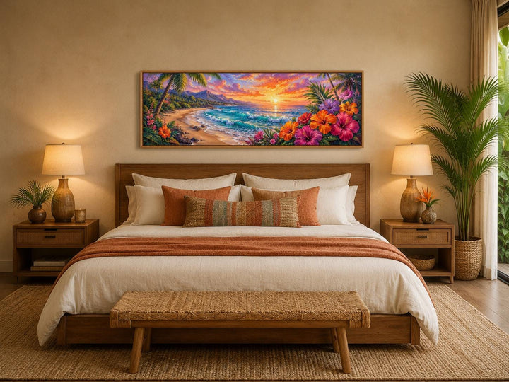 Vibrant Hawaiian beach sunset canvas print with tropical flowers above a bed in a neutral bedroom.