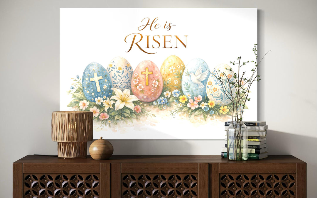 He Is Risen wall art featuring a floral Easter canvas print with crosses and a dove on a sideboard.