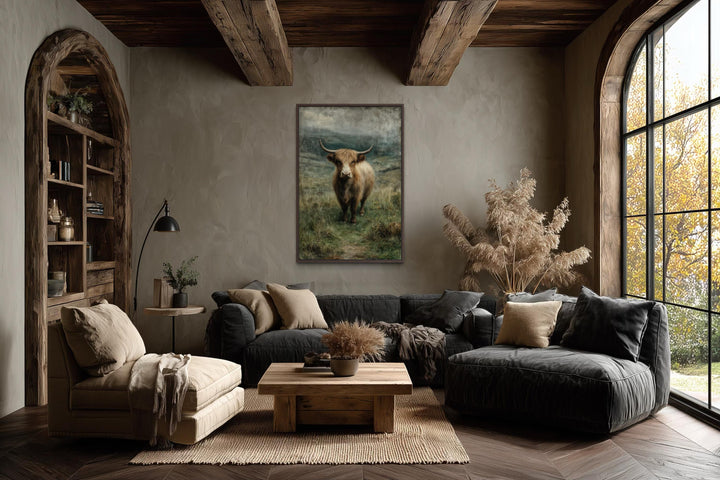 Vertical canvas wall art featuring a Highland cow in a green pasture within a rustic living room.