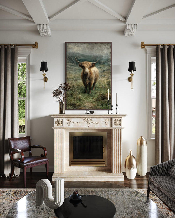 Vertical canvas wall art featuring a Highland cow in a lush green pasture above a fireplace.