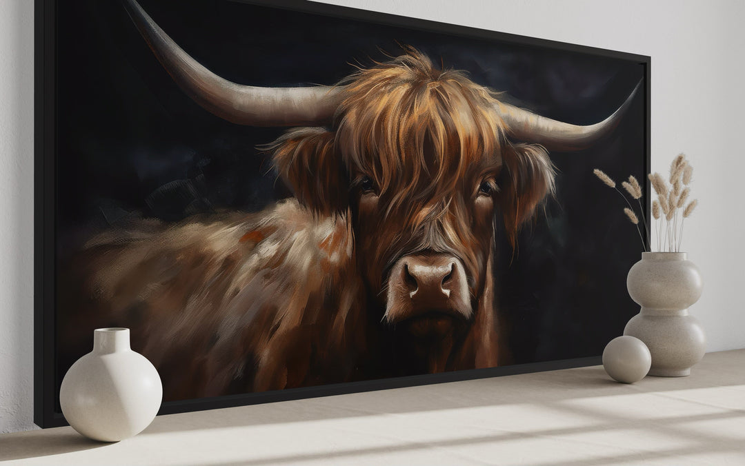Highland cow framed canvas wall art with a black background and rustic farmhouse decor.