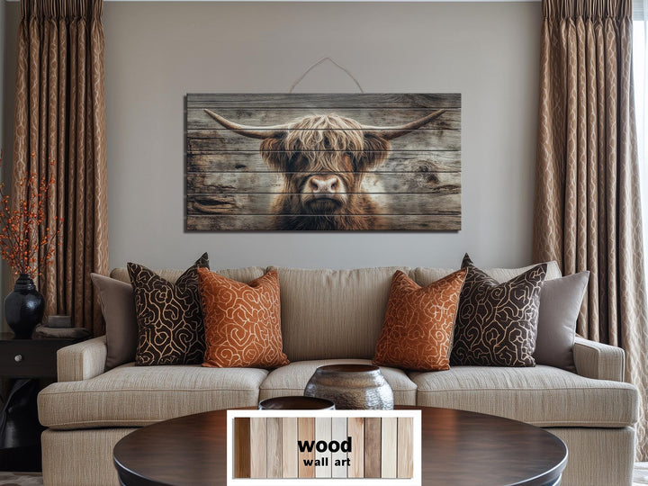 Horizontal wood wall art featuring a rustic Highland cow portrait on natural wooden planks.