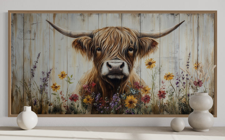 Rustic Highland cow canvas print with colorful wildflowers on a wood-plank background.