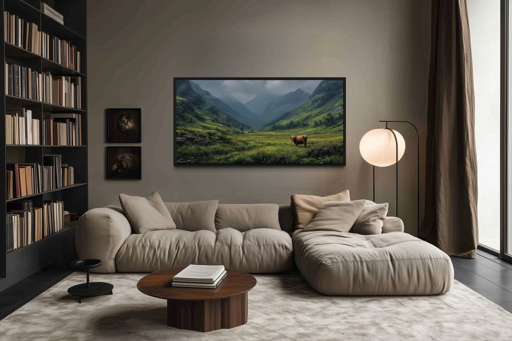 Highland cow in a green valley landscape wall art above a modern sofa in a cozy living room.