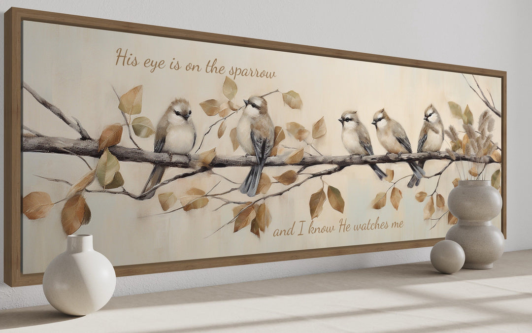 Framed canvas wall art featuring five sparrows on a branch with scripture text in neutral tones.