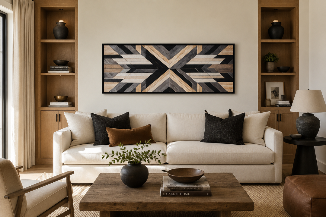 Horizontal Aztec inspired wood painting canvas wall art with geometric design over a white sofa.