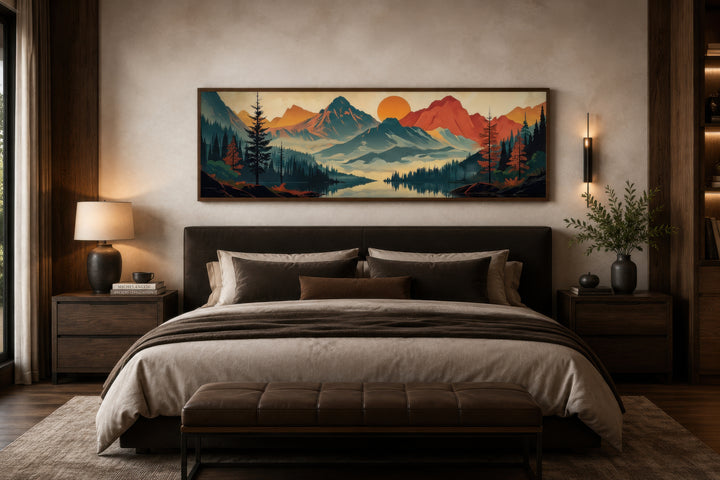 Mid-century modern horizontal canvas art of mountains, forest, and lake hanging above a bed.