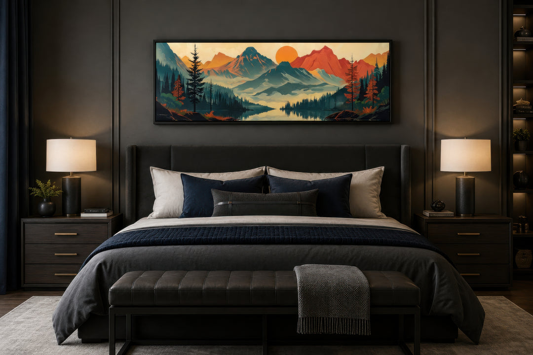 Horizontal mid-century modern canvas art of mountains, forest, and lake above a dark grey bed.