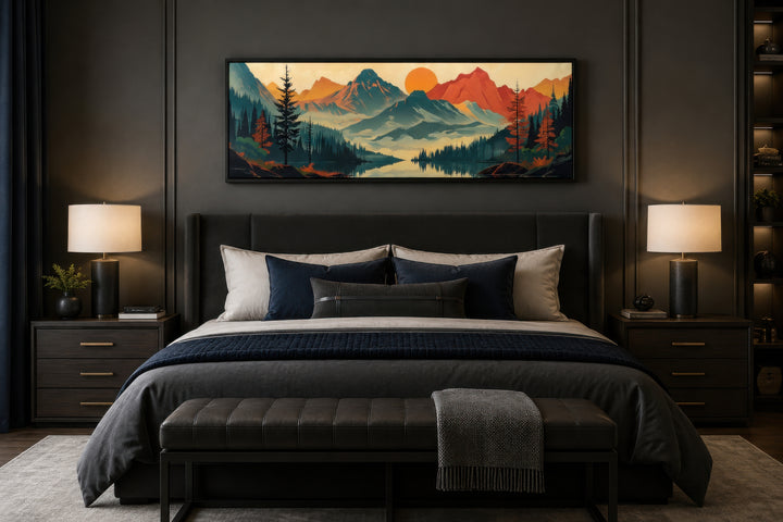 Horizontal mid-century modern canvas art of mountains, forest, and lake above a dark grey bed.