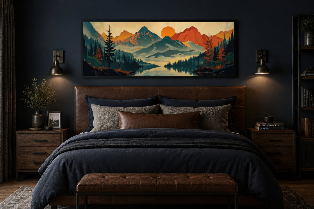 Horizontal canvas wall art of a mountain, forest, and lake landscape above a bed in a dark room.