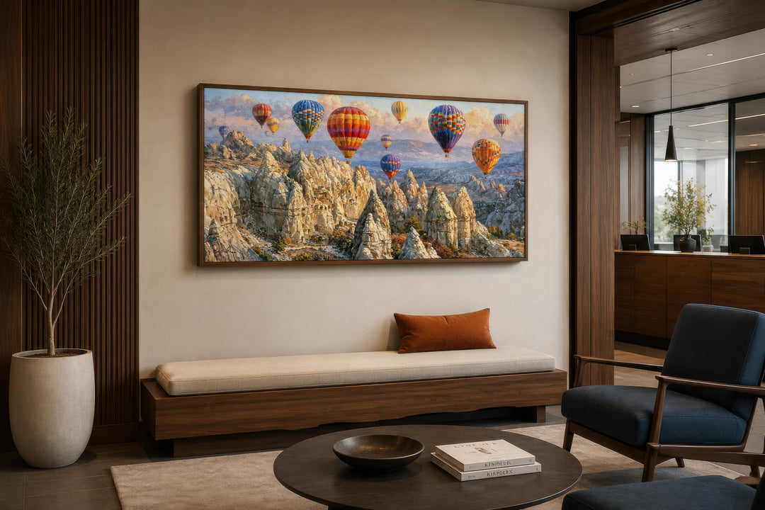 A wide horizontal canvas print of colorful hot air balloons over the Cappadocia landscape.